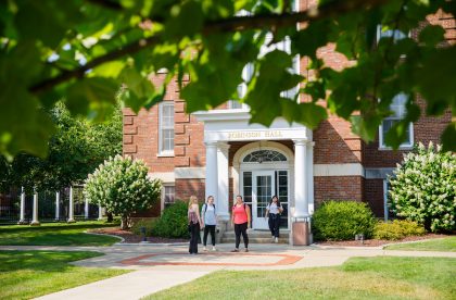 Students standing outside of Robinson Hall.