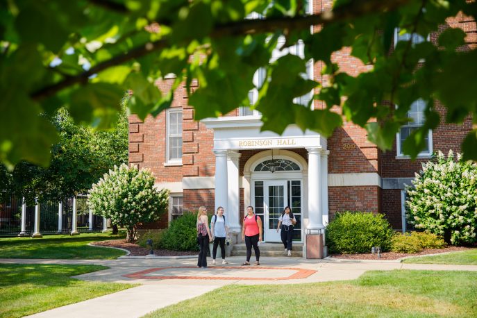 Students standing outside of Robinson Hall.
