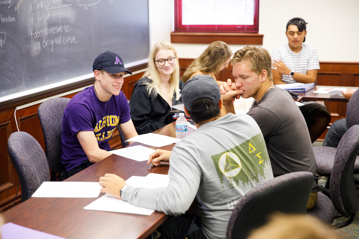 Students working together around a table