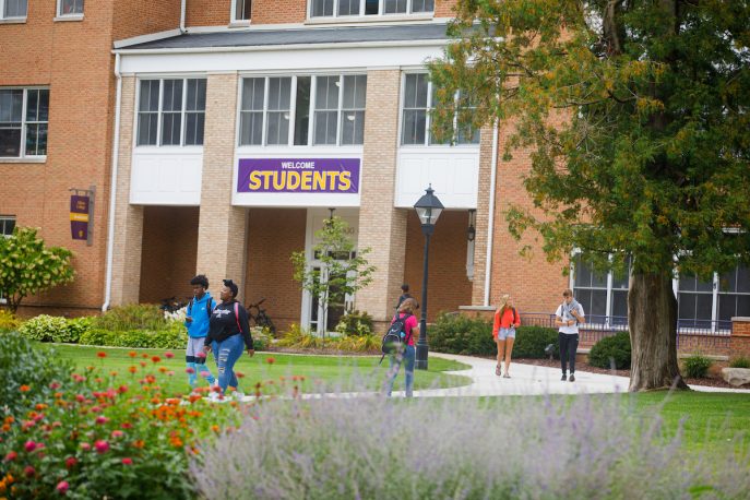 Students walking outside on campus.