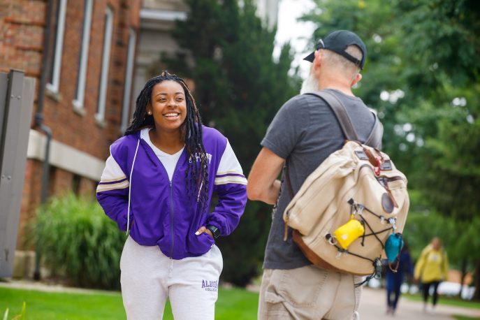 Albion College community members talking with one another on campus