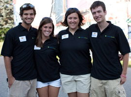 An alumn with 3 Albion students. 