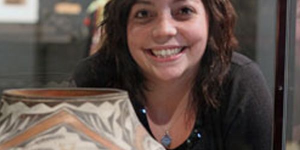 A headshot of a student smiling.