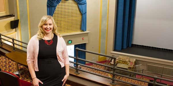 A student in a movie theater.