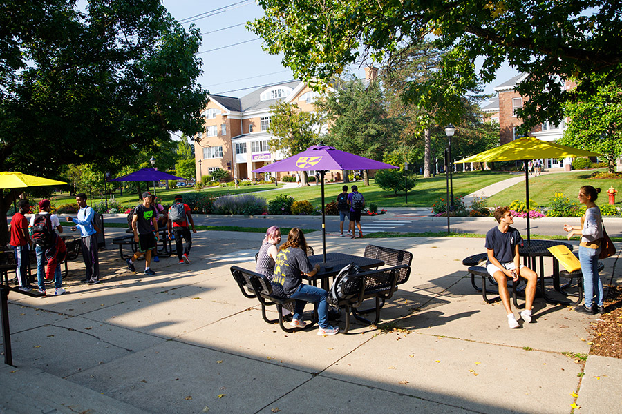Albion College students outside Baldwin Hall.