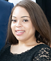 A headshot of a student wearing a black shirt smiling.