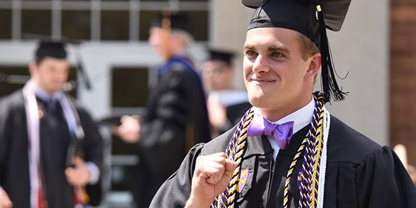 A student in a cap and gown.