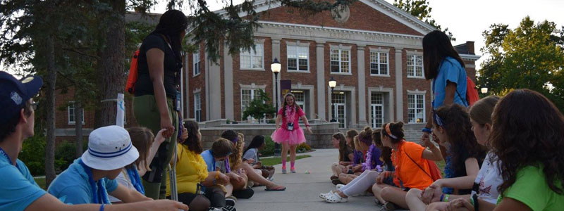 Students gathered on the sidewalk