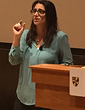A speaker next to a podium.
