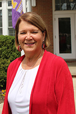 A person wearing a coral cardigan.