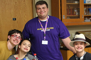 Teacher Mike Whittaker standing with some students.