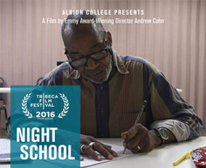 A man writing with a pen.