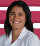 A headshot of a woman against a background of pink and white stripes.