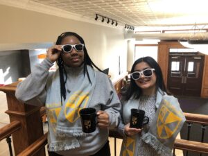 Two students wearing sunglasses.