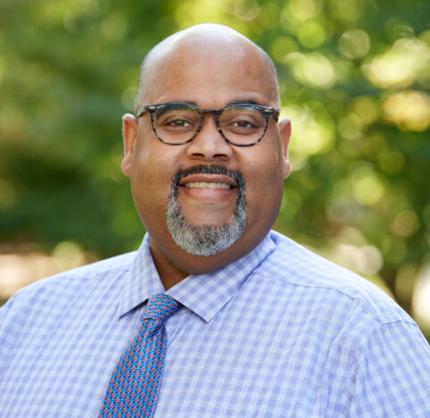 A professional headshot of Leroy Wright.