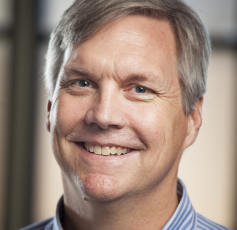 A professional headshot of Drew Dunham.