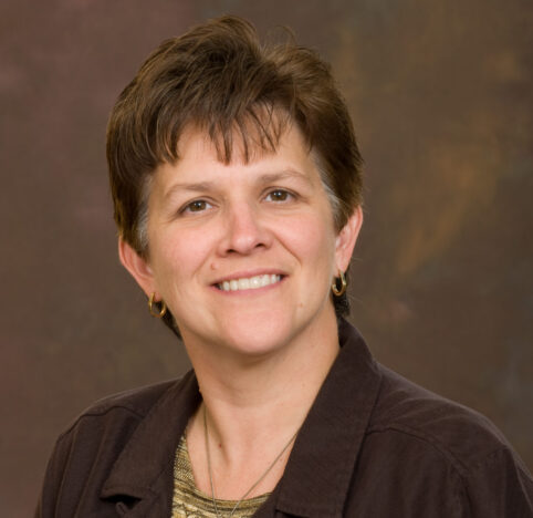 A professional headshot of Lisa Locke.