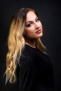 A professional headshot of Lara Hakamaki.