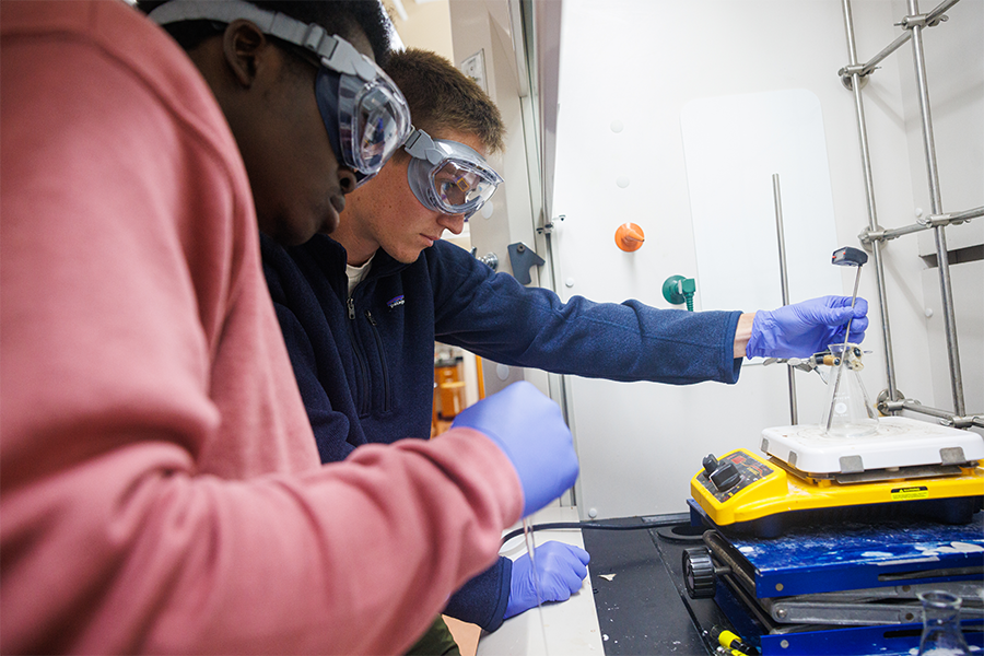 Students conducting an experiment in a chemistry lab.