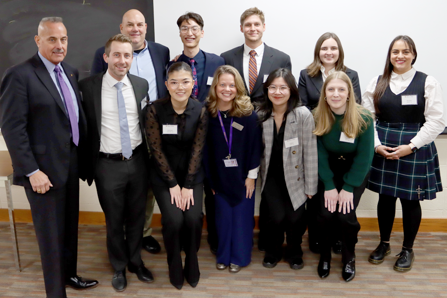 The students pose with the Black & Rossi team.