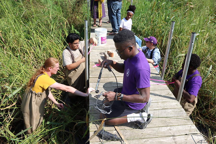 Students conducting research at the river