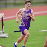 Robert running in his track uniform